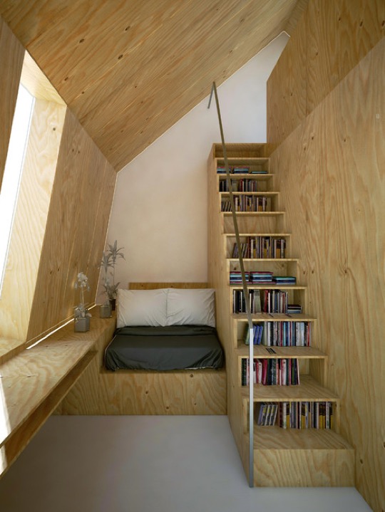 Scandinavian stairway library and reading nook