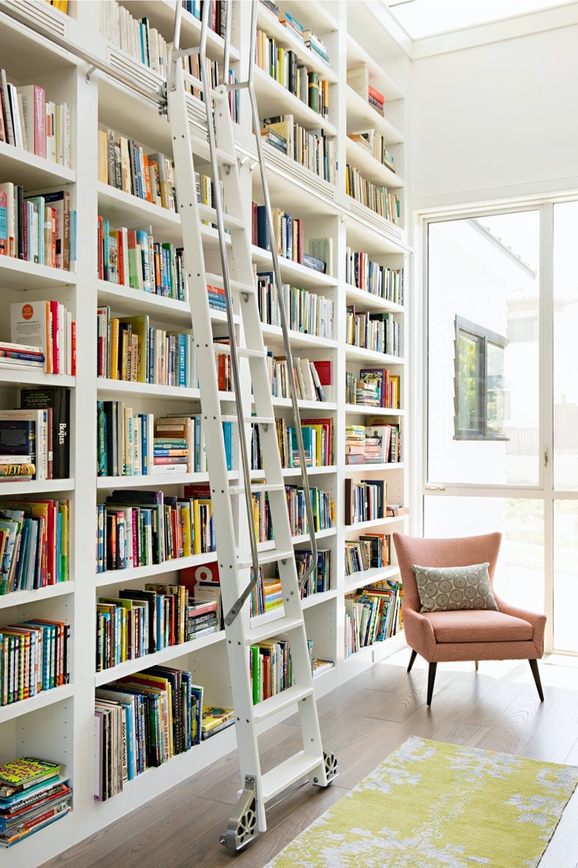 White library in a sunny family room - home library designs